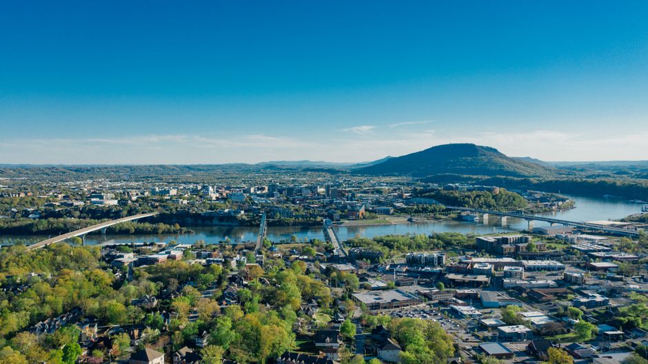A beautiful modern home in Chattanooga, Tennessee, with a scenic view of the surrounding mountains, representing the local high-value real estate market.