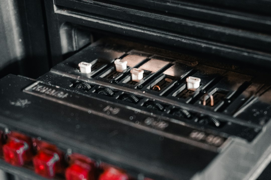 Close-up of a modern, clean electrical circuit breaker panel, symbolizing financial safety and control over one's home inv...